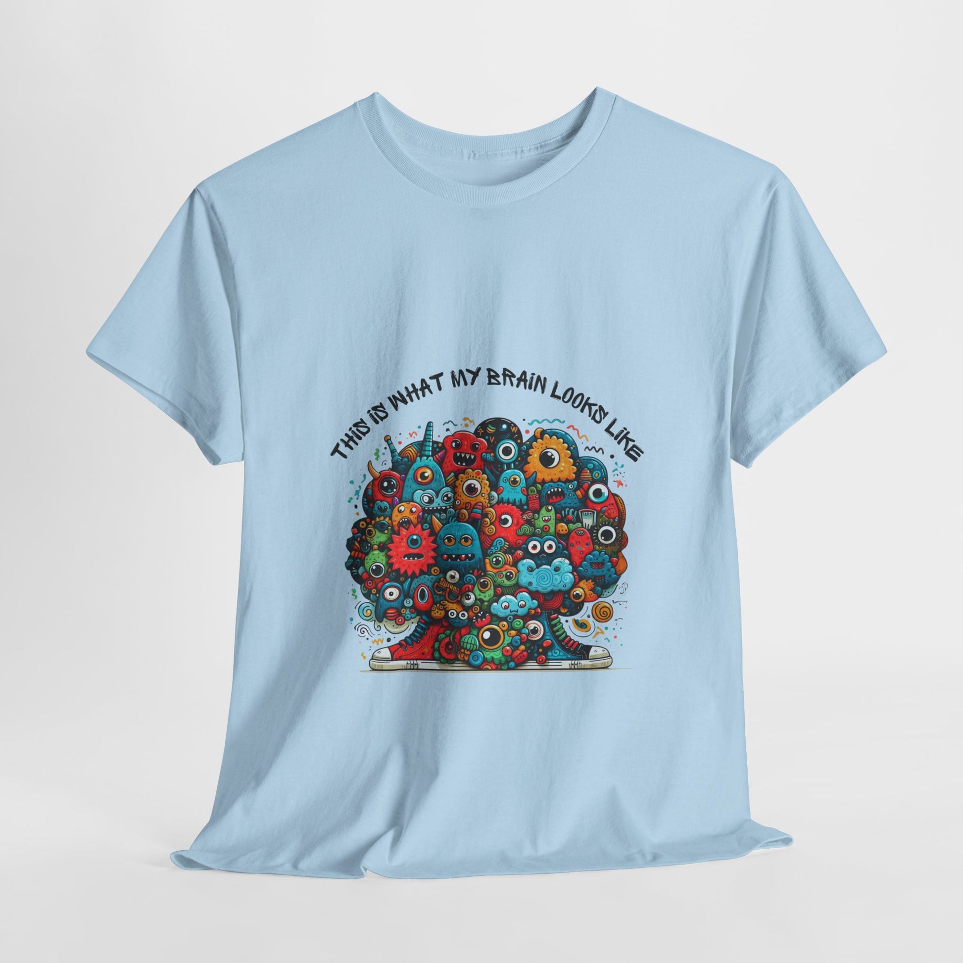 Unisex heavy cotton t-shirt featuring a playful doodle collage design with quirky, edgy urban style. Boldly printed with the slogan "This is what my brain looks like," it’s an instant conversation starter perfect for streetwear fans, casual outings, festivals, and everyday wear.