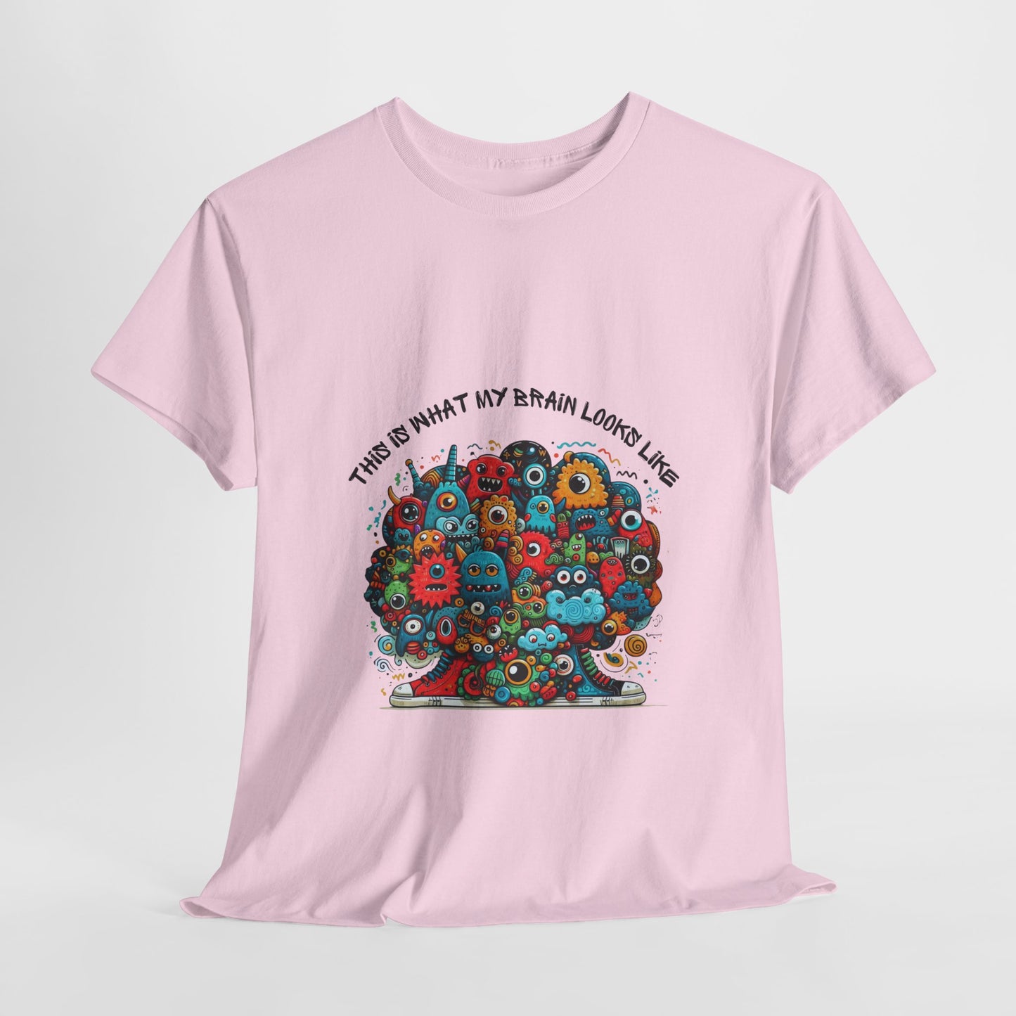 Unisex heavy cotton t-shirt featuring a playful doodle collage design with quirky, edgy urban style. Boldly printed with the slogan "This is what my brain looks like," it’s an instant conversation starter perfect for streetwear fans, casual outings, festivals, and everyday wear.